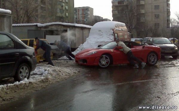 Ferrari is being towed by Daewoo Tico... only in Romania!